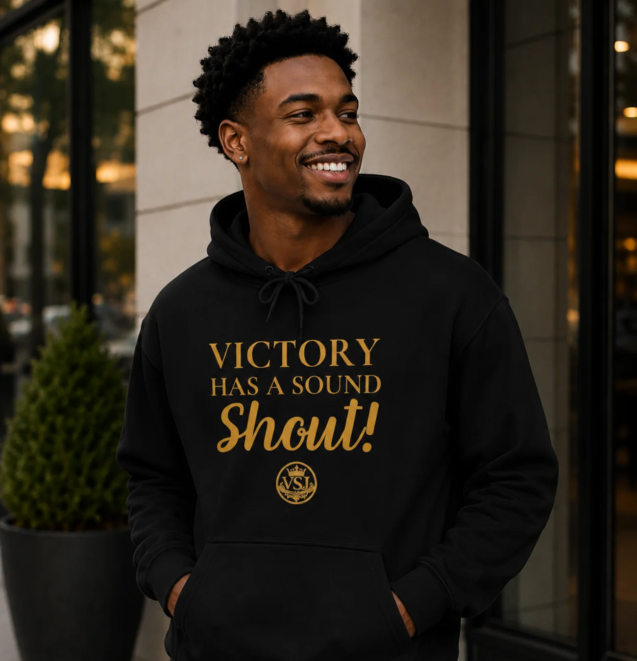 Man wearing black Victory Has a Sound hoodie